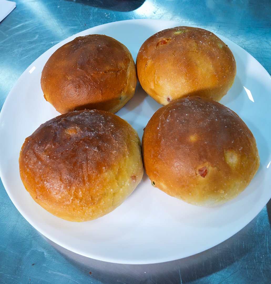 Bun Maska buns on a white plate
