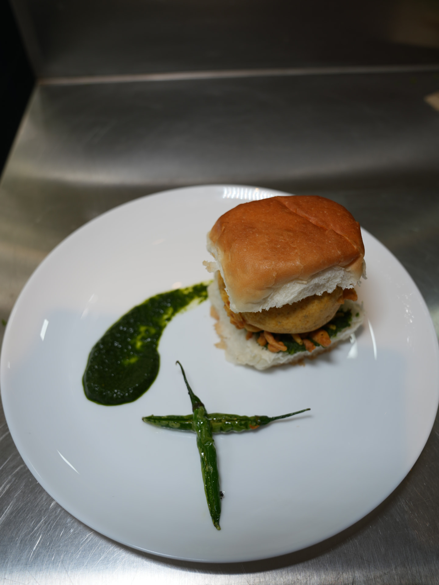 Vada pav with chutney and green chilli